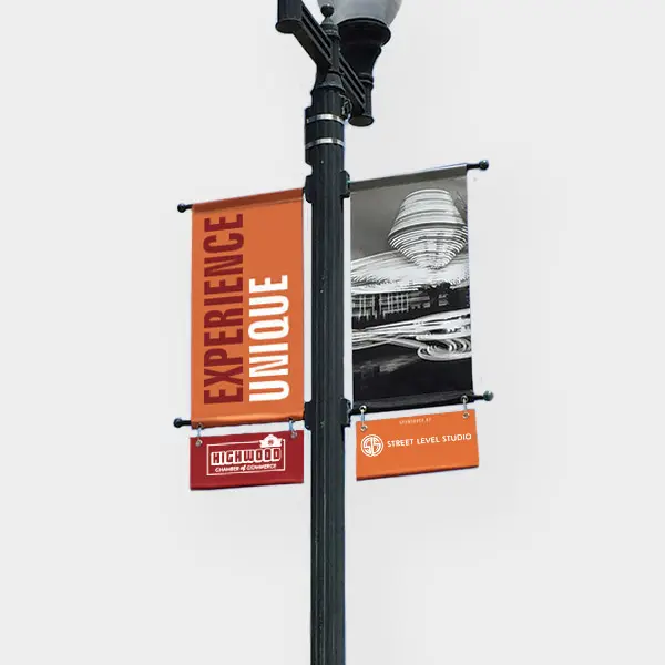 A lamppost displays street banners Street Level Studio designed and produced for Highwood, Illinois.