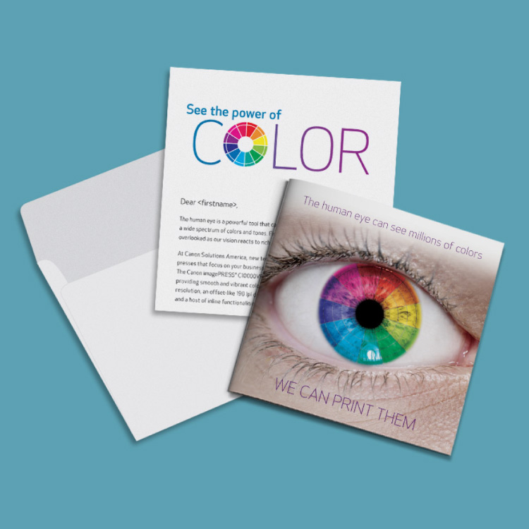 Two pages and an envelope. One of the pages shows a human eye, the iris is all the colors of the rainbow.