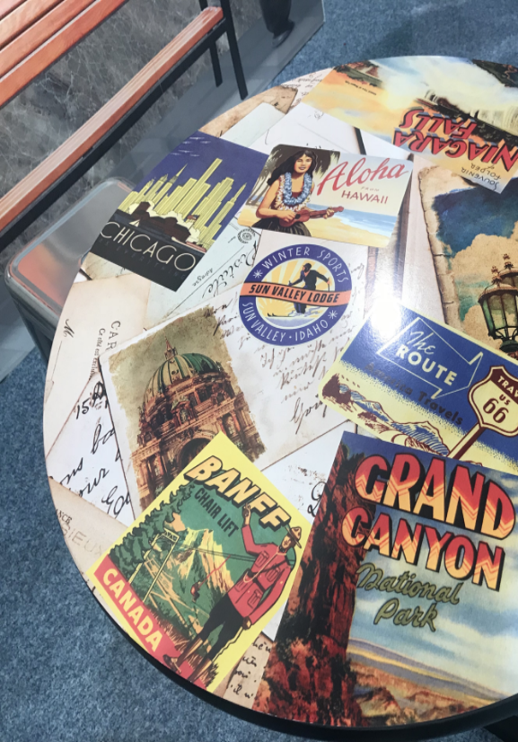 a circular item with nostalgic images of various states and national parks
