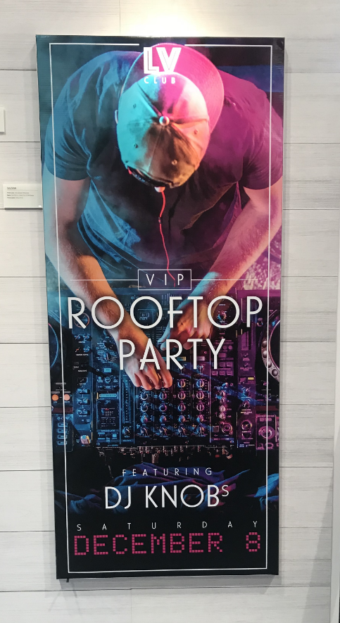 a sign that reads VIP Rooftop Party