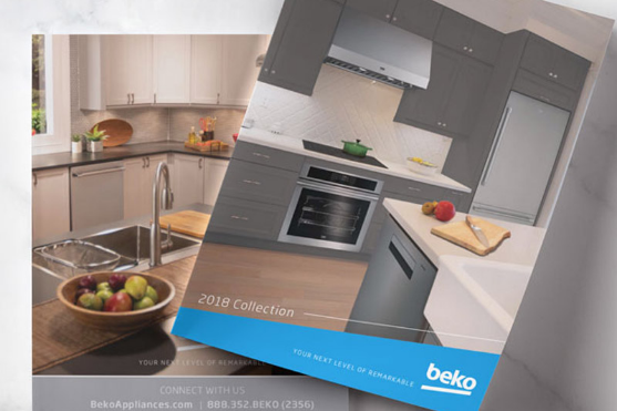 two booklets sit on a granite countertop, they advertise beko appliances