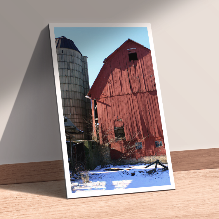 image of a red barn and gray silo in the snow