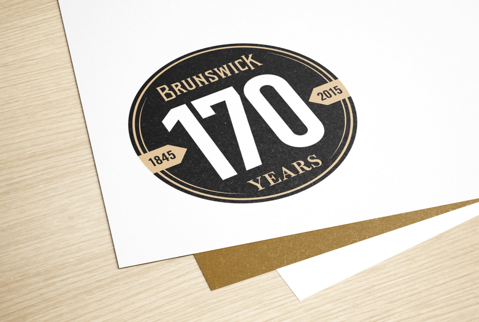 papers sitting on a table showing the Brunswick logo