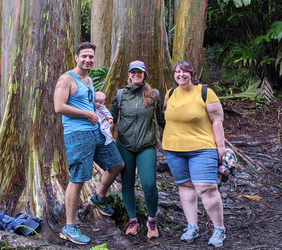 staff-jenna-1122-04 Jenna and friends hiking through a forest