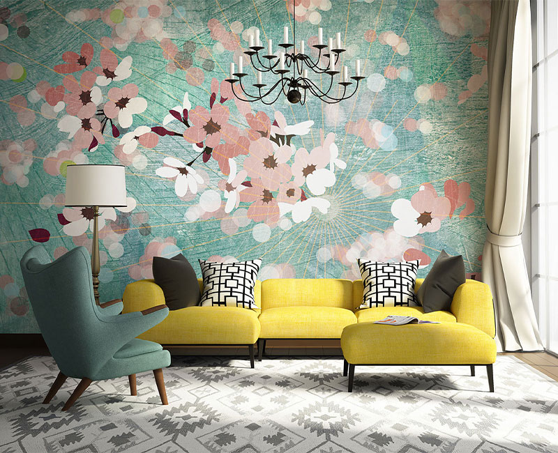 living room with a yellow couch, teal chair, and custom flower wallpaper