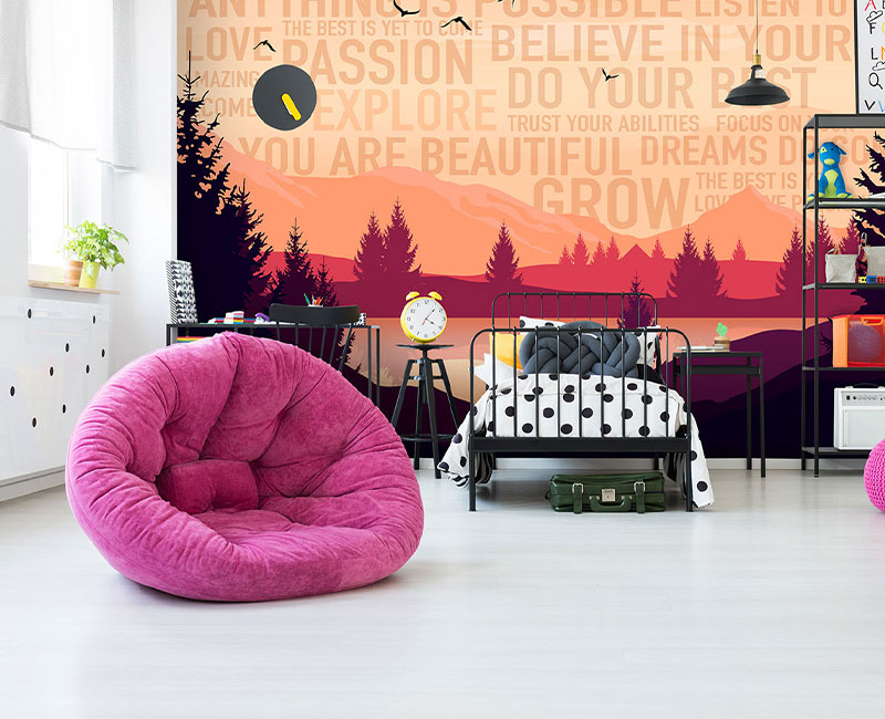 a bedroom with a black and white bed, pink chair, and custom scenic wallpaper